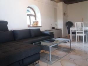 a living room with a couch and a table at Haus Forstamt in Stadtsteinach