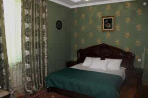 Postel nebo postele na pokoji v ubytování Green Guest House
