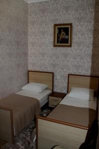 Postel nebo postele na pokoji v ubytování Green Guest House