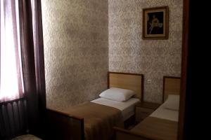 Postel nebo postele na pokoji v ubytování Green Guest House