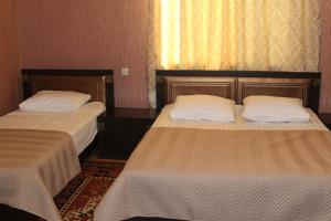 Postel nebo postele na pokoji v ubytování Green Guest House