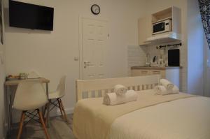Postel nebo postele na pokoji v ubytování Amalia Apartments