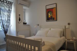 Postel nebo postele na pokoji v ubytování Amalia Apartments