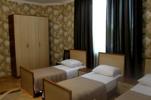 Postel nebo postele na pokoji v ubytování Green Guest House