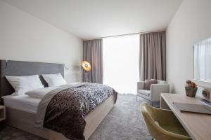 Postel nebo postele na pokoji v ubytování monte mare SAUNA-SPA-SPORTS-HOTEL
