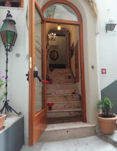 
a doorway leading to a room with a staircase leading to a room with a at Albergo S. Andrea in Amalfi
