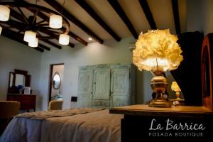 Una cama o camas en una habitación de Posada Boutique La Barrica