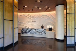 a man stands in the lobby of a new hotel at Nobu Hotel Miami Beach in Miami Beach +159 photos