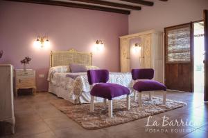 Una cama o camas en una habitación de Posada Boutique La Barrica