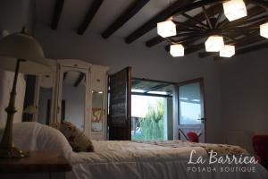 Una cama o camas en una habitación de Posada Boutique La Barrica