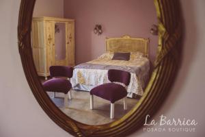 Una cama o camas en una habitación de Posada Boutique La Barrica