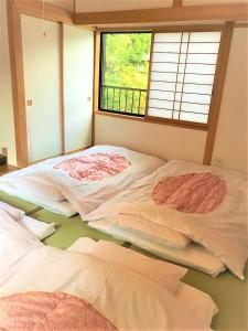 Krevet ili kreveti u jedinici u okviru objekta Koyasan Guest House Tommy