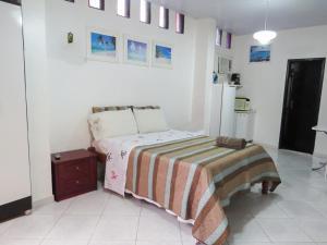Postel nebo postele na pokoji v ubytování Amanda Suites MAO