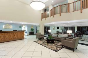 a lobby with couches and chairs and a table at Wingate by Wyndham Yuma in Yuma