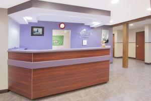 a lobby of a hospital with a reception counter at Microtel Inn and Suites Manistee in Manistee