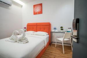 Postel nebo postele na pokoji v ubytování My Sj Hotel