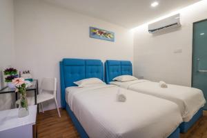 Postel nebo postele na pokoji v ubytování My Sj Hotel