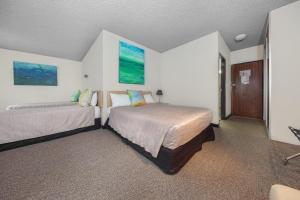 
Belconnen Way Hotel & Serviced Apartments tesisinde bir odada yatak veya yataklar
