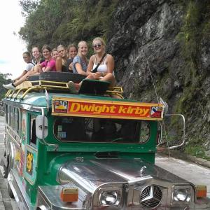 a group of people riding on the top of a bus at BATAD CRISTINA'S Main Village INN & Restaurant in Banaue