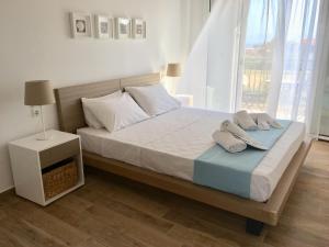 A bed or beds in a room at Alegria Kefalonia