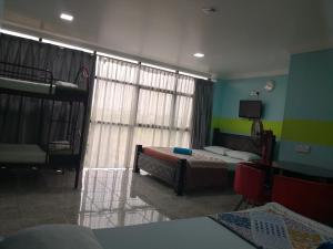 Postel nebo postele na pokoji v ubytování Kristal Inn Hotel UITM Shah Alam