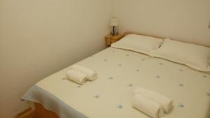 Postel nebo postele na pokoji v ubytování Apartments Gaston