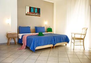 Ένα ή περισσότερα κρεβάτια σε δωμάτιο στο Stratos Hotel 