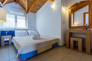 Postel nebo postele na pokoji v ubytování Hotel Akti