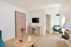 Televisor o centre d'entreteniment de Harvey's luxury rooms