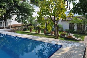 a swimming pool in front of a house at Garden House in Selçuk