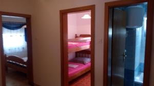a room with two bunk beds and a mirror at Lubin in Sevid