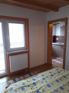 A bed or beds in a room at Chalupa Vaclav