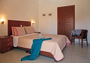 Ένα ή περισσότερα κρεβάτια σε δωμάτιο στο Stratos Hotel 