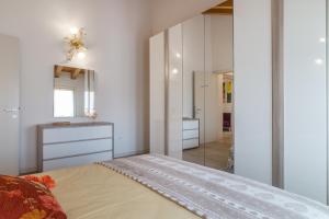 A bed or beds in a room at Cimadolmo Prosecco And History