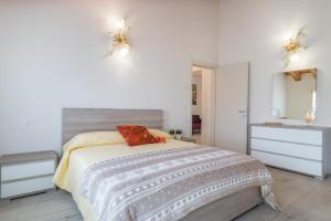 A bed or beds in a room at Cimadolmo Prosecco And History