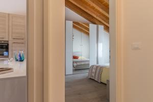 A bed or beds in a room at Cimadolmo Prosecco And History