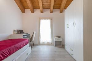 A bed or beds in a room at Cimadolmo Prosecco And History