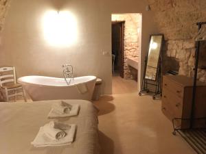Postel nebo postele na pokoji v ubytování Agriturismo Le Fornelle