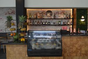 Sohvabaar või baar majutusasutuses Cuna Hotel