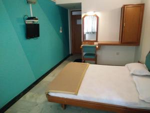 Postel nebo postele na pokoji v ubytování Hotel GRG