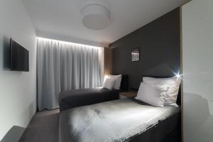 Vuode tai vuoteita majoituspaikassa Apart-Hotel VIVI RESIDENCE & SPA