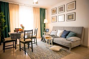 a living room with a couch and a table at Sea View Apartment in Center of Las Americas in Playa de las Americas