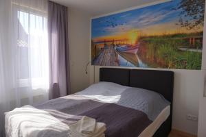 Łóżko lub łóżka w pokoju w obiekcie Apartamenty i Domki Osińscy
