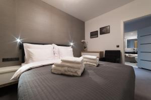 Postel nebo postele na pokoji v ubytování Apart-Hotel VIVI RESIDENCE & SPA