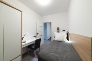 Postel nebo postele na pokoji v ubytování Apart-Hotel VIVI RESIDENCE & SPA