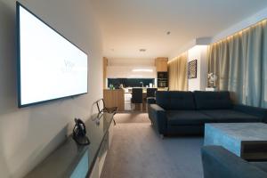 TV a/nebo společenská místnost v ubytování Apart-Hotel VIVI RESIDENCE & SPA