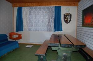 a room with a wooden table and a window at Lomasaaret in Villala