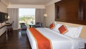 Postel nebo postele na pokoji v ubytování Shakun Hotels And Resorts