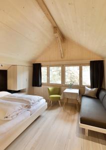 A bed or beds in a room at Försterhaus Mellau