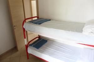 A bed or beds in a room at Appartamento Sabrina